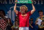 Sammy shows off sign for the new "Hagar Way" that will be built in Fontana